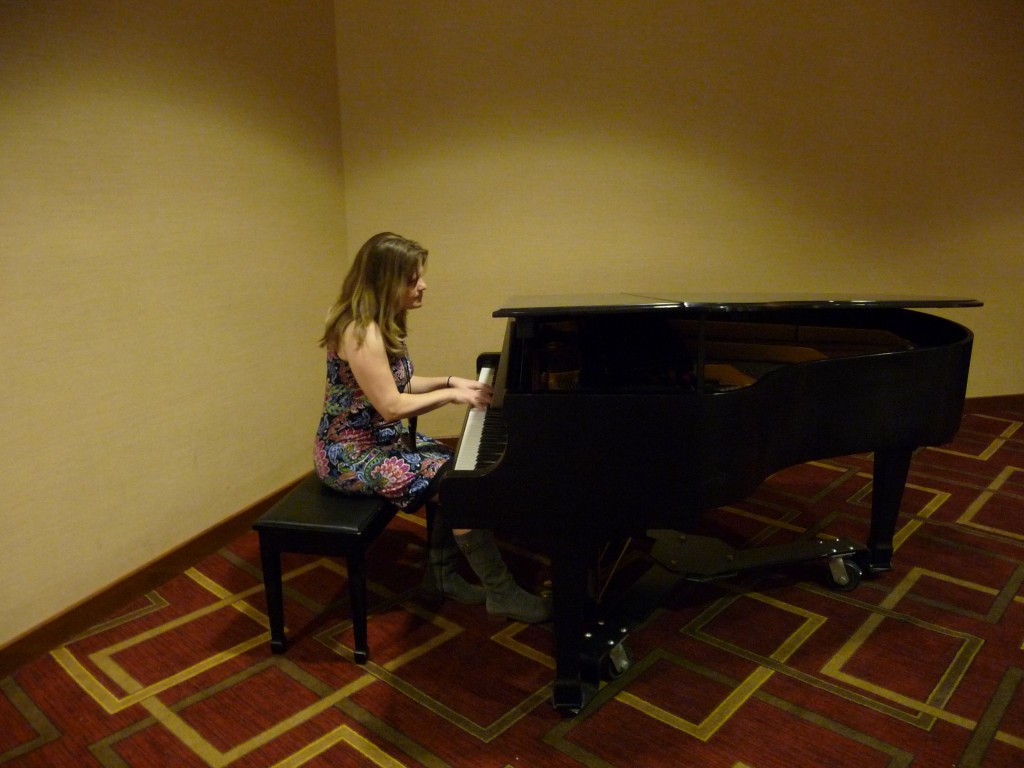 The hotel's lowest level had a grand piano that cried out to Julie. Her compositions for my SIGNS AND SHADOWS made its debut at World Fantasy 2014 in an impromptu concert. Some of the hotel staff stopped to listen appreciatively and praise the pianist.