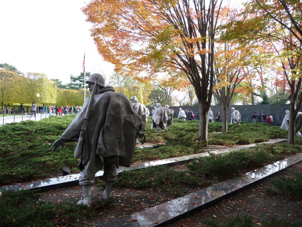 The platoon wearily, warily patrols, unearthly under their load of gear and rain ponchos.