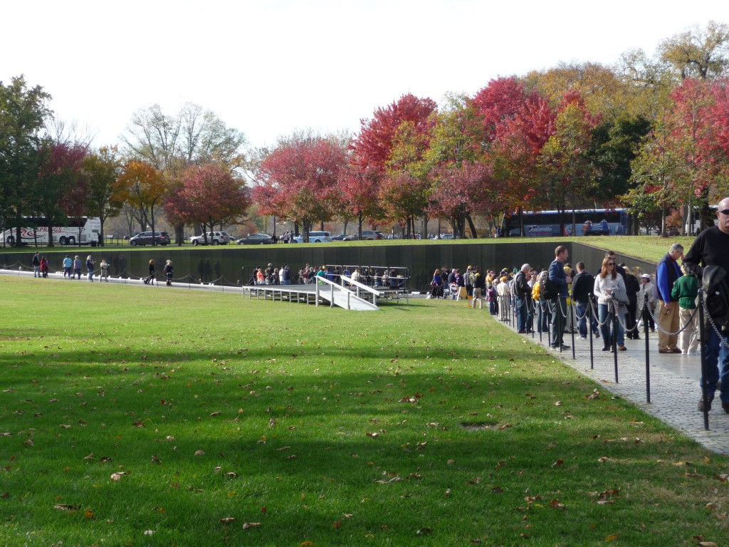 The Vietnam War Memorial Wall -- we found the names of a member of our church and of an Illinois boy who fought alongside my cousin. Crowds of people there on the sunny Sunday were leaving roses, honoring, mourning, remembering . . .