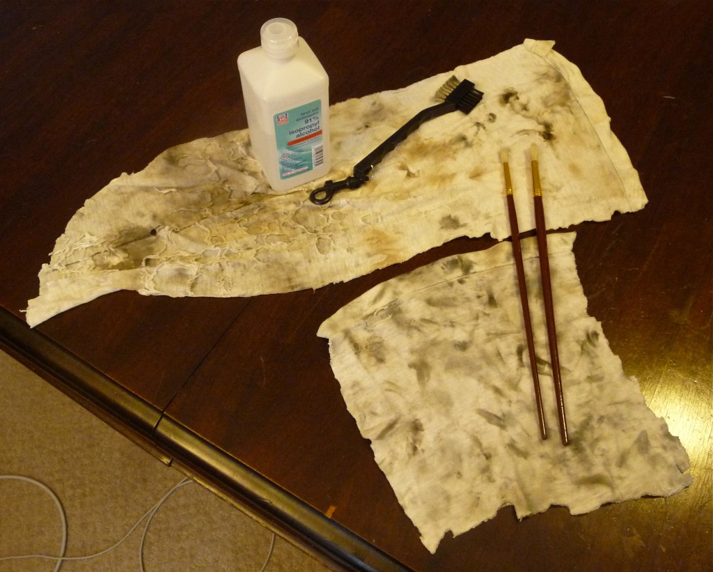 Rags, rubbing alcohol, long-handled paintbrushes, and a brush from Trader Horn designed for golf equipment: wire bristles on one side, fiber bristles on the other.
