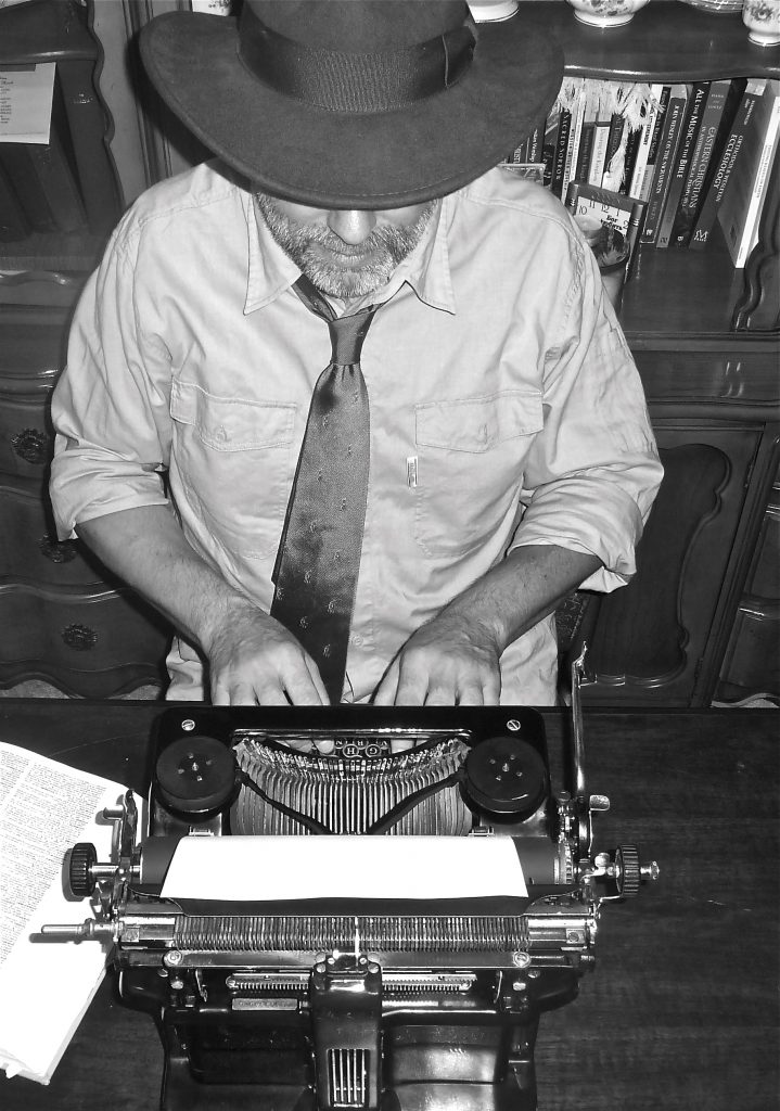 I liked Julie's answer on Facebook when a friend asked of these photos, "Does Fred really do that?" She replied, "Pose for goofy photos? Check. Use antique typewriters all the time? That, too. Sit around in a fedora and tie? Not so much."